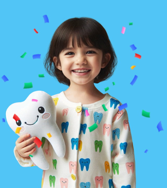 Happy smiling child holding a plush tooth with colorful confetti at Just 4 Kidz Dental Ottawa